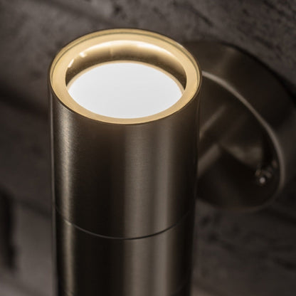 The modern Alesha wall lamp is distinguished by its unique design and the highest quality of workmanship. It has an IP65 rating, which ensures that the lamp will work safely in rain and dust. This lamp is ideal for lighting the front door, terrace, garden or garage. 