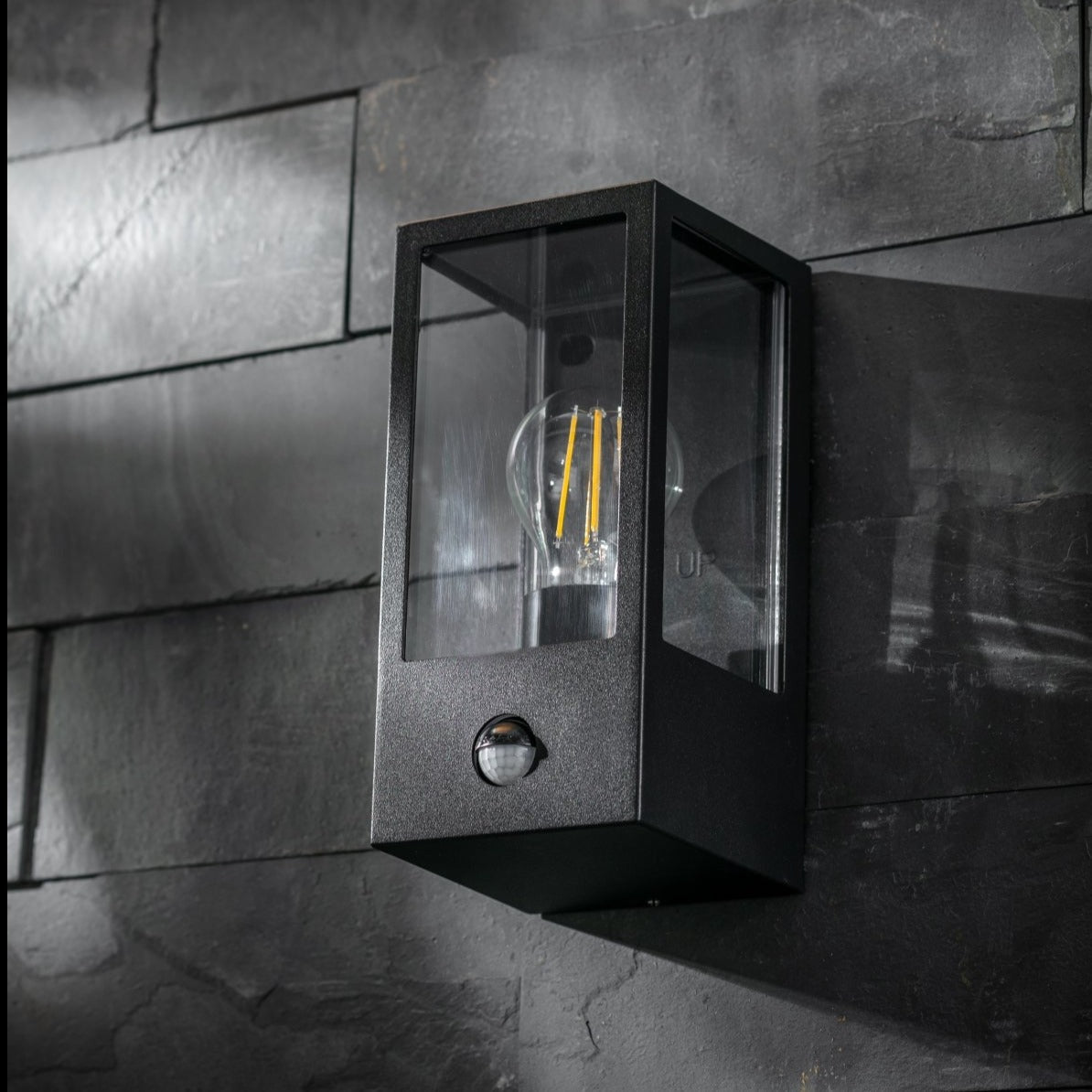 Our Marina black aluminium outdoor wall mounted lantern outdoor light with clear polycarbonate diffusers would look perfect in a modern or more traditional home design. Outside wall lights can provide atmospheric light in your garden, at the front door or on the terrace as well as a great security solution.