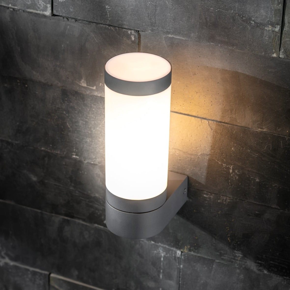 Our Rome grey anthracite outdoor wall light with opal diffuser would look perfect in a modern or more traditional home design. Outside wall lights can provide atmospheric light in your garden, at the front door or on the terrace as well as a great security solution. It is designed for durability and longevity with its robust material producing a fully weatherproof and water resistant light fitting.