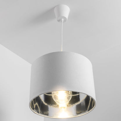 Our Nila velvet shade is sophisticated in appearance and we have designed the shade to  suit a range of interiors. Easy to fit, it’s crafted from high-quality velvet on the outer and has a reflective Silver metallic inner. It's made to fit both a ceiling light or lamp base.
