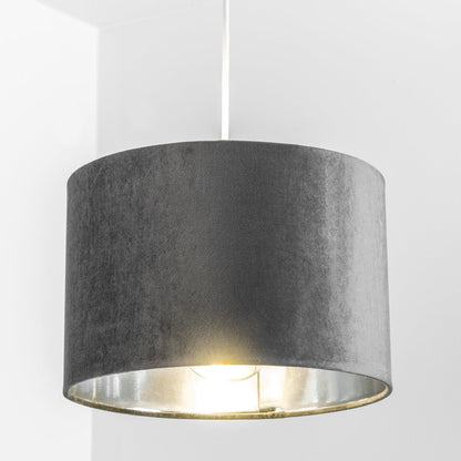 Our Nila velvet shade is sophisticated in appearance and we have designed the shade to  suit a range of interiors. Easy to fit, it’s crafted from high-quality velvet on the outer and has a reflective silver metallic inner. It's made to fit both a ceiling light or lamp base.