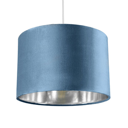 Our Nila velvet shade is sophisticated in appearance and we have designed the shade to  suit a range of interiors. Easy to fit, it’s crafted from high-quality velvet on the outer and has a reflective silver metallic inner. It's made to fit both a ceiling light or lamp base.
