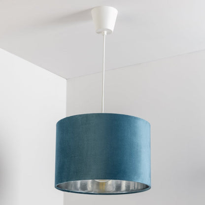 Our Nila velvet shade is sophisticated in appearance and we have designed the shade to  suit a range of interiors. Easy to fit, it’s crafted from high-quality velvet on the outer and has a reflective silver metallic inner. It's made to fit both a ceiling light or lamp base.
