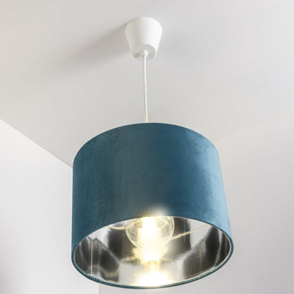 Our Nila velvet shade is sophisticated in appearance and we have designed the shade to  suit a range of interiors. Easy to fit, it’s crafted from high-quality velvet on the outer and has a reflective silver metallic inner. It's made to fit both a ceiling light or lamp base.