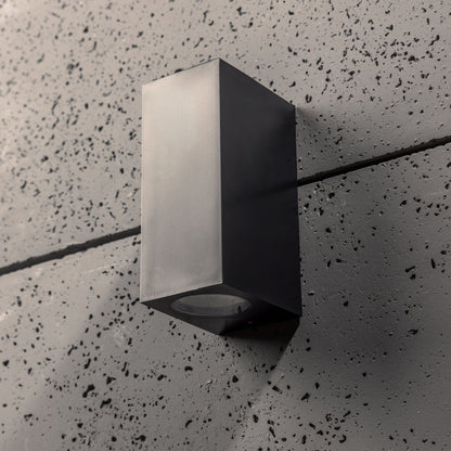 Our Eileen black up and down wall mounted rectangle outdoor light would look perfect in a modern or more traditional home design. Outside wall lights can provide atmospheric light in your garden, at the front door or on the terrace as well as a great security solution. It is designed for durability and longevity with its robust material producing a fully weatherproof and water resistant light fitting.
