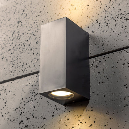 Our Eileen black up and down wall mounted rectangle outdoor light would look perfect in a modern or more traditional home design. Outside wall lights can provide atmospheric light in your garden, at the front door or on the terrace as well as a great security solution. It is designed for durability and longevity with its robust material producing a fully weatherproof and water resistant light fitting.