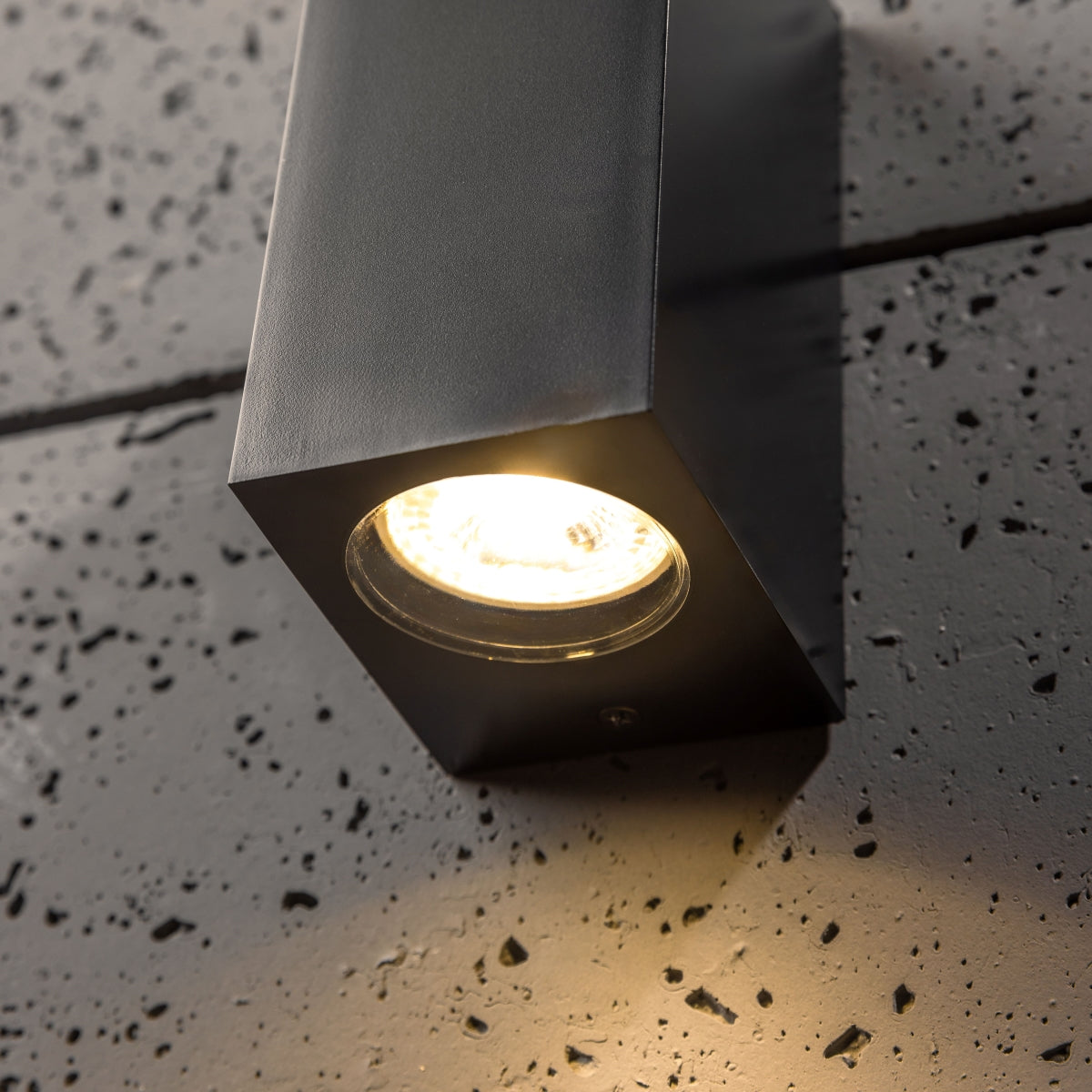 Our Eileen black up and down wall mounted rectangle outdoor light would look perfect in a modern or more traditional home design. Outside wall lights can provide atmospheric light in your garden, at the front door or on the terrace as well as a great security solution. It is designed for durability and longevity with its robust material producing a fully weatherproof and water resistant light fitting.