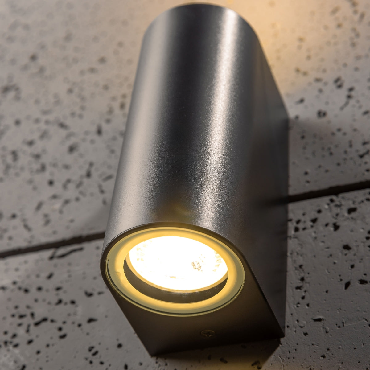 Our Eileen black wall mounted curved double outdoor spotlight light would look perfect in a modern or more traditional home design. Outside wall lights can provide atmospheric light in your garden, at the front door or on the terrace as well as a great security solution. It is designed for durability and longevity with its robust material producing a fully weatherproof and water resistant light fitting.