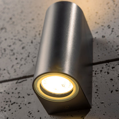 Our Eileen black wall mounted curved double outdoor spotlight light would look perfect in a modern or more traditional home design. Outside wall lights can provide atmospheric light in your garden, at the front door or on the terrace as well as a great security solution. It is designed for durability and longevity with its robust material producing a fully weatherproof and water resistant light fitting.