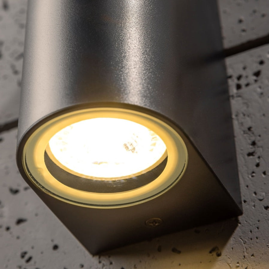 Our Eileen black wall mounted curved double outdoor spotlight light would look perfect in a modern or more traditional home design. Outside wall lights can provide atmospheric light in your garden, at the front door or on the terrace as well as a great security solution. It is designed for durability and longevity with its robust material producing a fully weatherproof and water resistant light fitting.