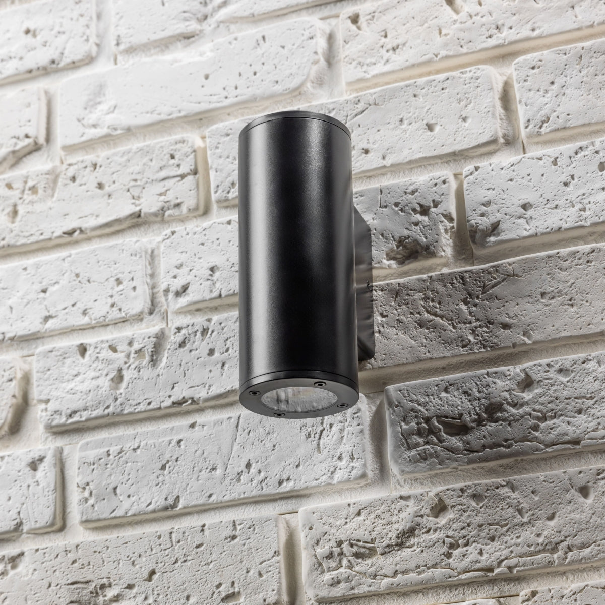 Our Sherri up and down black cylinder wall light would look perfect in a modern or more traditional home design. Outside lights can provide atmospheric light in your garden, at the front door, patio, walls driveway or on the terrace as well as a great security solution. It is designed for durability and longevity with its robust material producing a fully weatherproof and water resistant light fitting. 