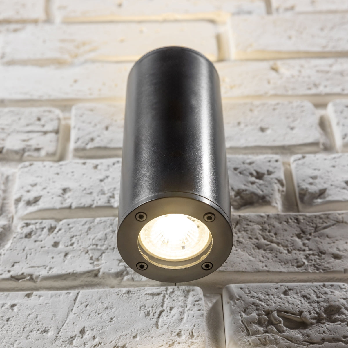 Our Sherri up and down black cylinder wall light would look perfect in a modern or more traditional home design. Outside lights can provide atmospheric light in your garden, at the front door, patio, walls driveway or on the terrace as well as a great security solution. It is designed for durability and longevity with its robust material producing a fully weatherproof and water resistant light fitting. 