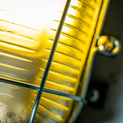 Our industrial style caged outdoor cage light is made from a high-quality polycarbonate body which is weather and rust proof and is complete with a prismatic glass diffuser and protective cage