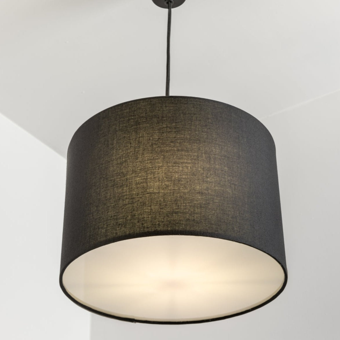 The Lucia is a modern cylinder drum shaped lamp shade in a luxury cotton finish and white opal diffuser, which cleverly enhances the room instantly when illuminated providing a uniform light. This fantastic shade can double up as either a ceiling pendant light shade or table lampshade. Easily fits to your standard ceiling light socket - no wiring required.