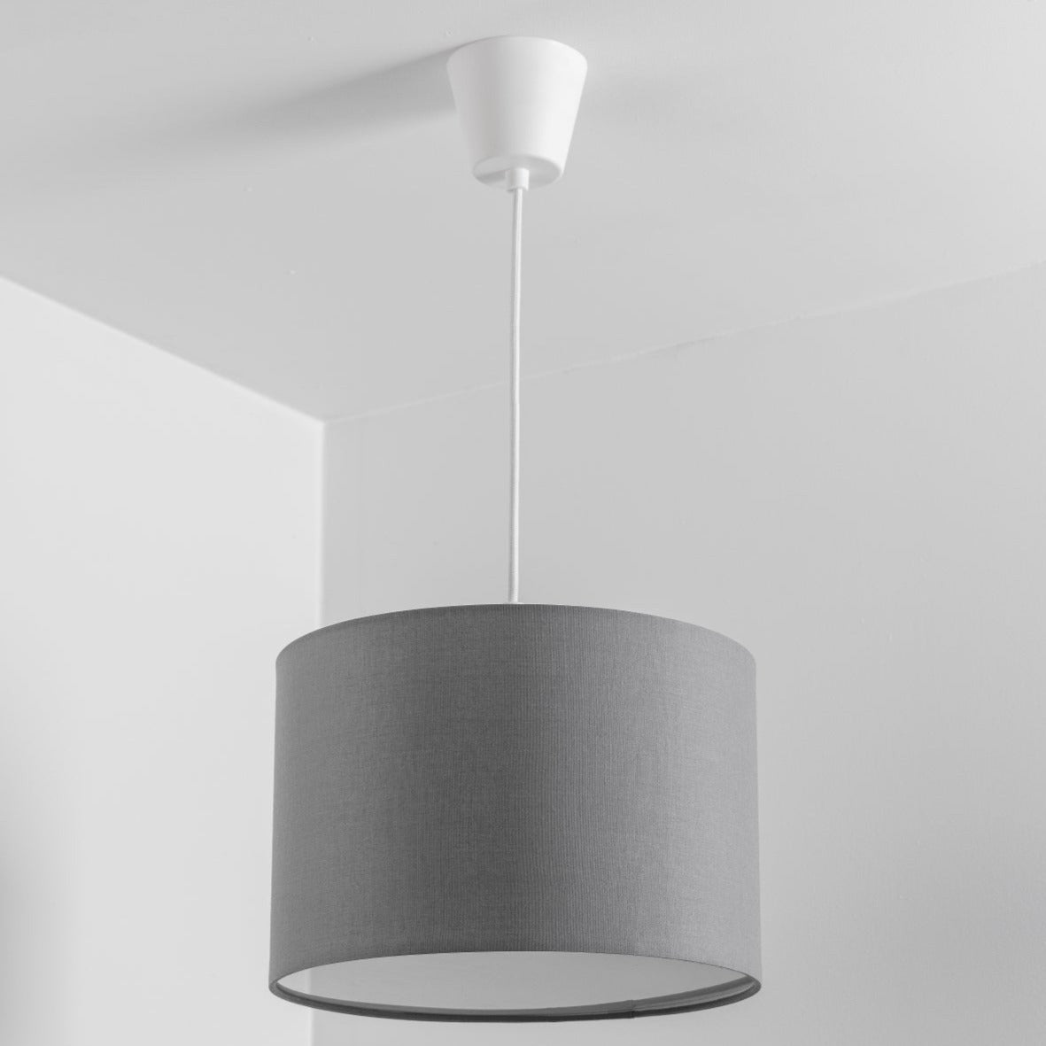 The Lucia is a modern cylinder drum shaped lamp shade in a luxury cotton finish and opal diffuser. This fantastic shade can double up as either a ceiling pendant light shade or table lampshade. Easily fits to your standard ceiling light fitting- no wiring required.