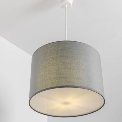 The Lucia is a modern cylinder drum shaped lamp shade in a luxury cotton finish and opal diffuser. This fantastic shade can double up as either a ceiling pendant light shade or table lampshade. Easily fits to your standard ceiling light fitting- no wiring required.