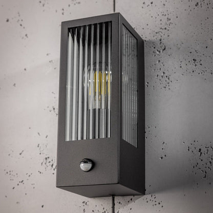 If you’re looking for a modern take on a traditional outdoor wall light, this modern bevelled glass rectangle wall light is perfect for adding style and protection for your home. This classic wall light is designed with a contemporary twist, styled with a rectangle shape and fitted with glass bevelled windows that allow the light to shine effectively. Integrated PIR Motion Sensor.