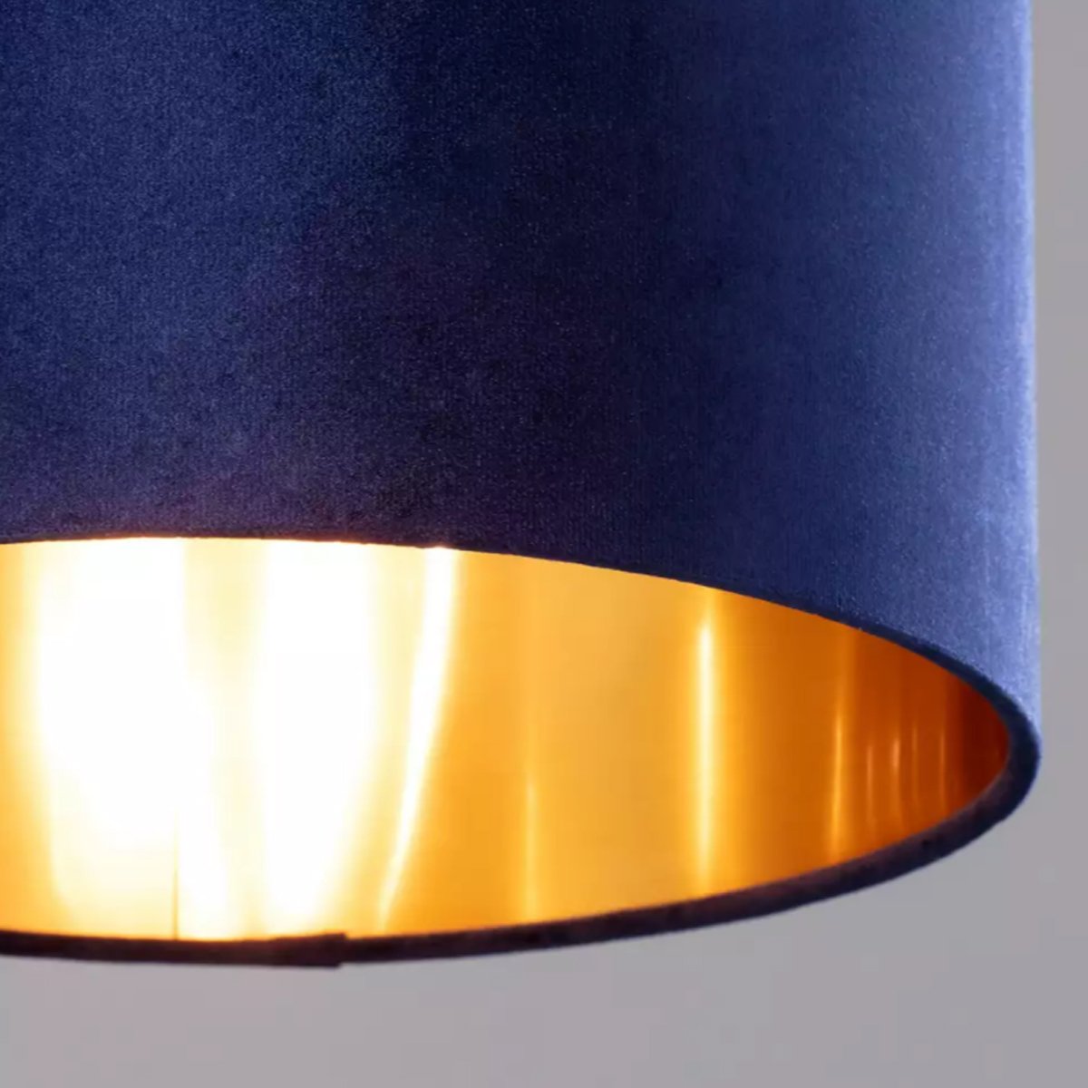 Our Nila velvet shade is sophisticated in appearance and we have designed the shade to  suit a range of interiors. Easy to fit, it’s crafted from high-quality velvet on the outer and has a reflective gold metallic inner. It's made to fit both a ceiling light or lamp base.