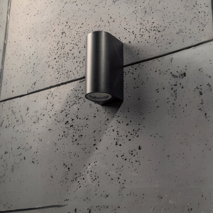 Our Eileen black wall mounted curved double outdoor spotlight light would look perfect in a modern or more traditional home design. Outside wall lights can provide atmospheric light in your garden, at the front door or on the terrace as well as a great security solution. It is designed for durability and longevity with its robust material producing a fully weatherproof and water resistant light fitting.