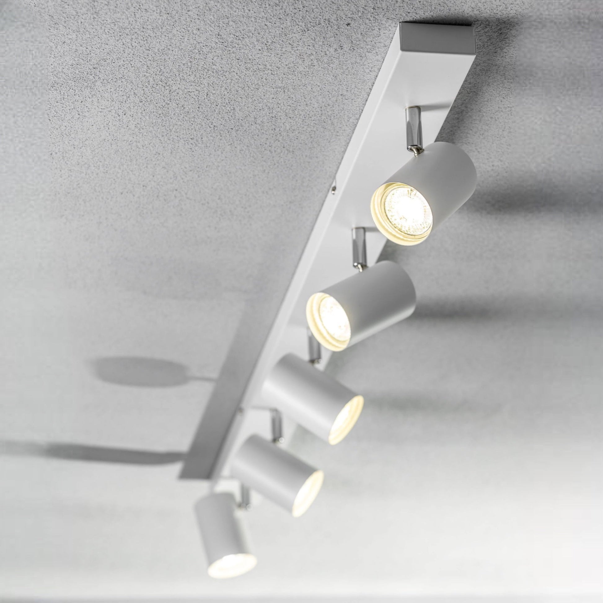 Add an industrial style to your home with the VENETO  spotlight light finished in white. The lamp is also ideal for task lighting due to the adjustable heads providing a focused beam. The simplistic design of this light fitting makes it suitable for all interior styles.