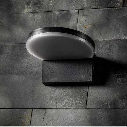 Our Aubrey black plastic ABS plastic outdoor wall mounted round outdoor light with built in LED's would look perfect in a modern or more traditional home design. Outside wall lights can provide atmospheric light in your garden, at the front door or on the terrace as well as a great security solution. It is designed for durability and longevity with its robust material producing a fully weatherproof and water resistant light fitting.