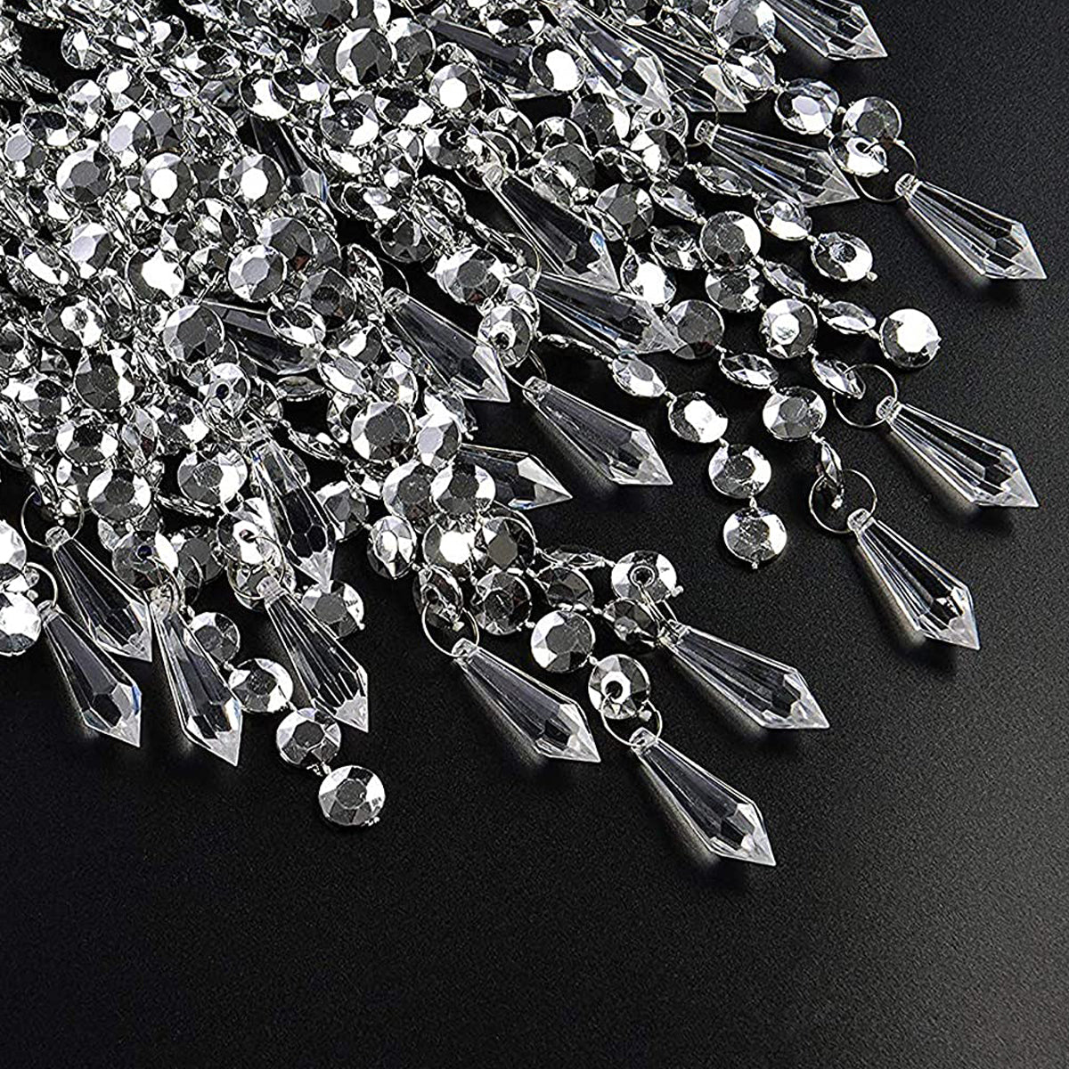 Our Liza easy fit ceiling pendant shade features polished chrome circular rings with varying lengths of acrylic crystal strands. This beautiful easy fit pendant shade will add glamour to any space whilst instantly updating your room without the need of an electrician. 