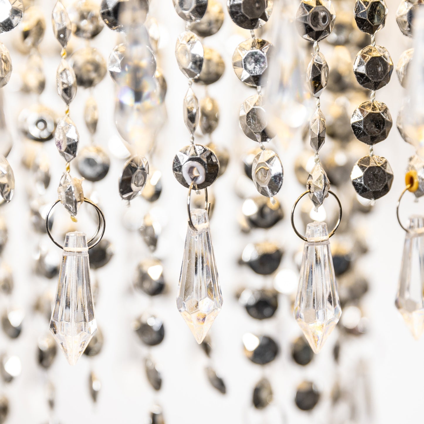 Our Liza easy fit ceiling pendant shade features polished chrome circular rings with varying lengths of acrylic crystal strands. This beautiful easy fit pendant shade will add glamour to any space whilst instantly updating your room without the need of an electrician. 