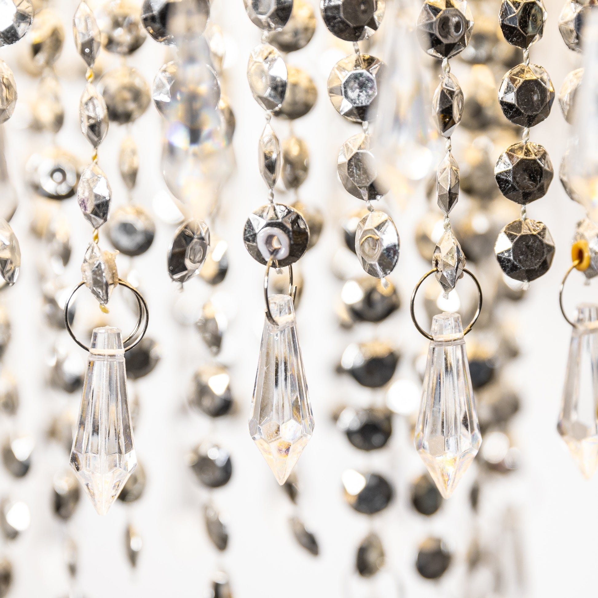 Our Liza easy fit ceiling pendant shade features polished chrome circular rings with varying lengths of acrylic crystal strands. This beautiful easy fit pendant shade will add glamour to any space whilst instantly updating your room without the need of an electrician. 