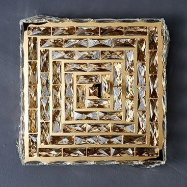 Introducing our Harmony ceiling light with its elegant crystal and golden finish it will be sure to make a stylish addition to any living space. It features an ornate cut glass crystal design encasing the entire light fitting and is complimented by a gold back plate that gives the light an undeniably luxurious style. Ceiling lamps don't come much more opulent than the Harmony ceiling light.