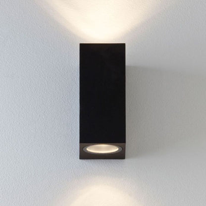 Our Eileen black up and down wall mounted rectangle outdoor light would look perfect in a modern or more traditional home design. Outside wall lights can provide atmospheric light in your garden, at the front door or on the terrace as well as a great security solution. It is designed for durability and longevity with its robust material producing a fully weatherproof and water resistant light fitting.
