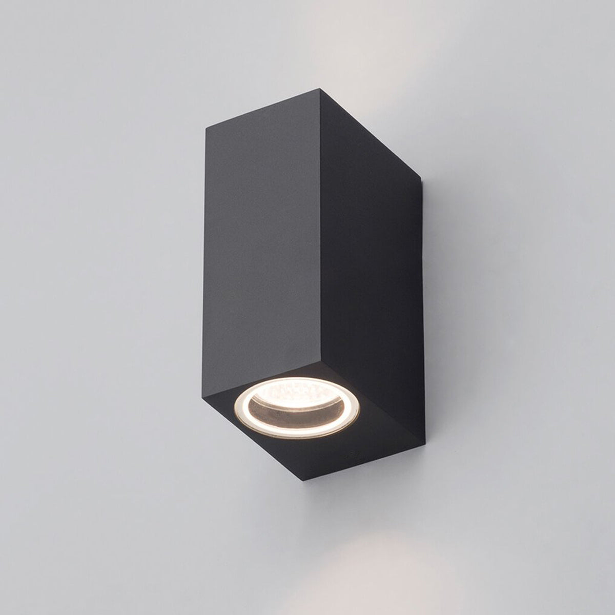 Our Eileen black up and down wall mounted rectangle outdoor light would look perfect in a modern or more traditional home design. Outside wall lights can provide atmospheric light in your garden, at the front door or on the terrace as well as a great security solution. It is designed for durability and longevity with its robust material producing a fully weatherproof and water resistant light fitting.