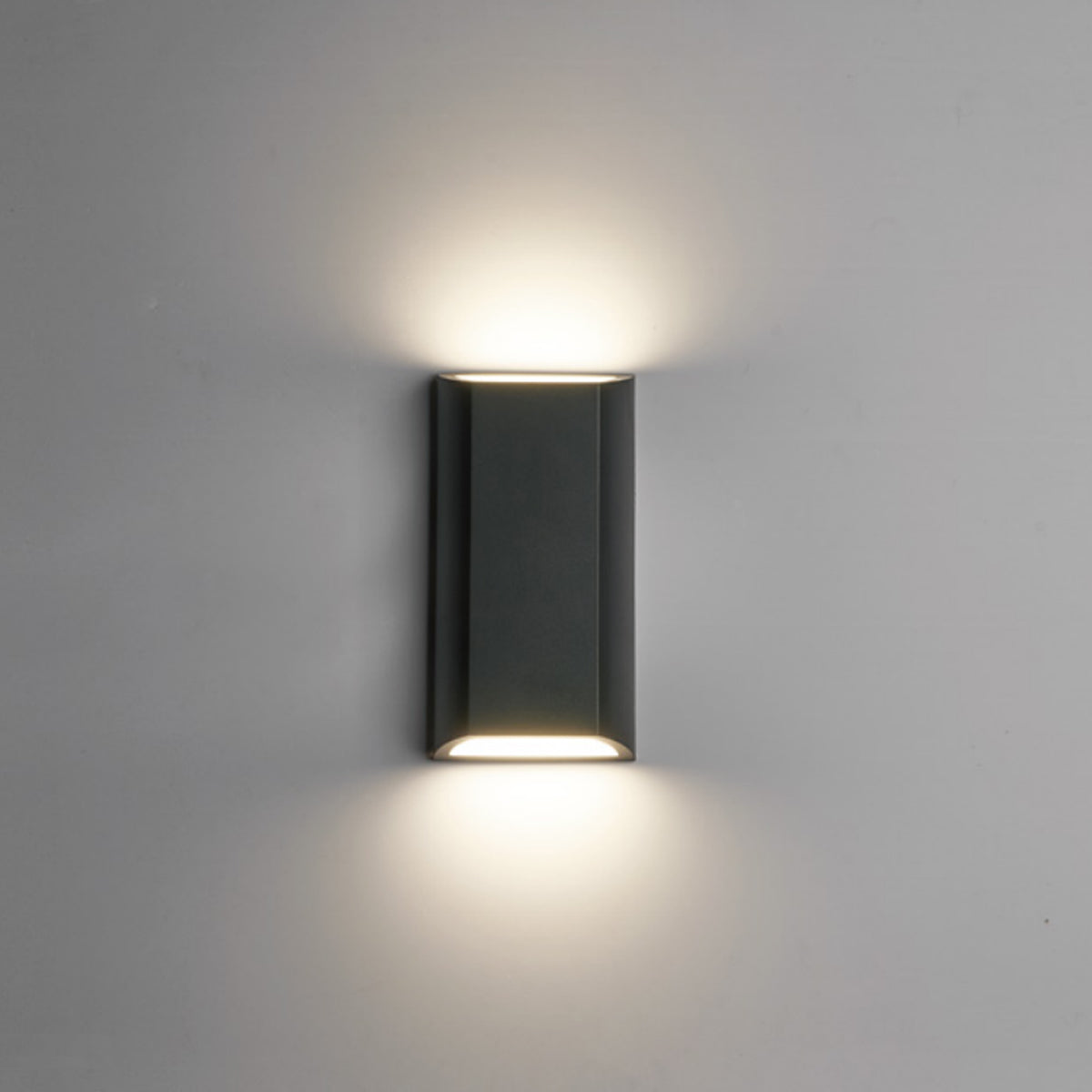 clear quality image of our WILMA dark grey rectangular wall light switched on showing white light on top and bottom applied to grey wall