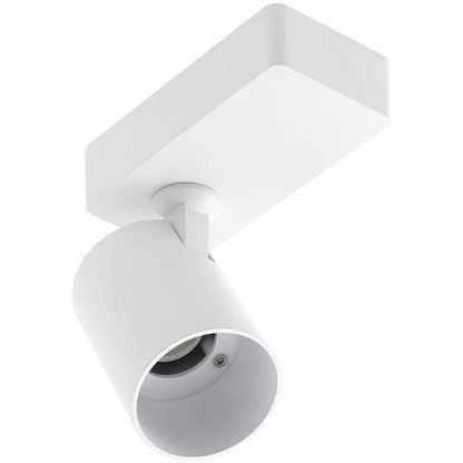 The white Nell lamp consists of a cylindrical spotlight, which can be tilted and adjusted on its own axis. The spotlight is attached to a rectangular bracket, which makes it equally suitable for mounting on walls and ceilings. Made of an aluminium body and powder coated white, the lamp with its simple design fits well into different spaces. 