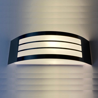 This stylish Striker outdoor light boasts a polycarbonate shade, crafted from stainless steel and adorned with a series of narrow stripes. Its surface disperses the lamp's light uniformly, creating a tranquil, inviting ambiance both indoors and out.