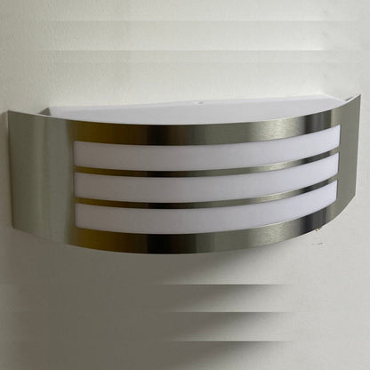 Stylish Striker with a shade made of polycarbonate is a hemispherical outdoor lamp holder, made of stainless steel, decorated with additional, narrower stripes. The surface distributes the light of the lamp softly and evenly, creating an atmospheric, pleasant light even outdoors.