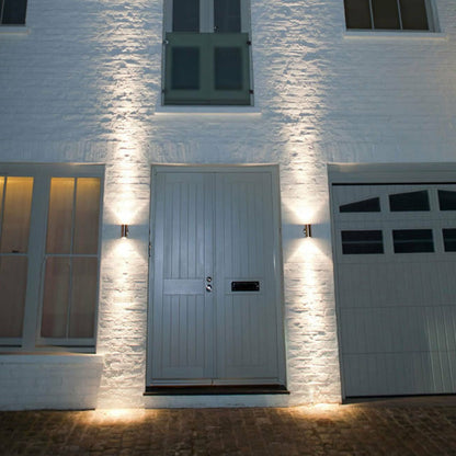 The modern Alesha wall lamp is distinguished by its unique design and the highest quality of workmanship. It has an IP65 rating, which ensures that the lamp will work safely in rain and dust. This lamp is ideal for lighting the front door, terrace, garden or garage. 